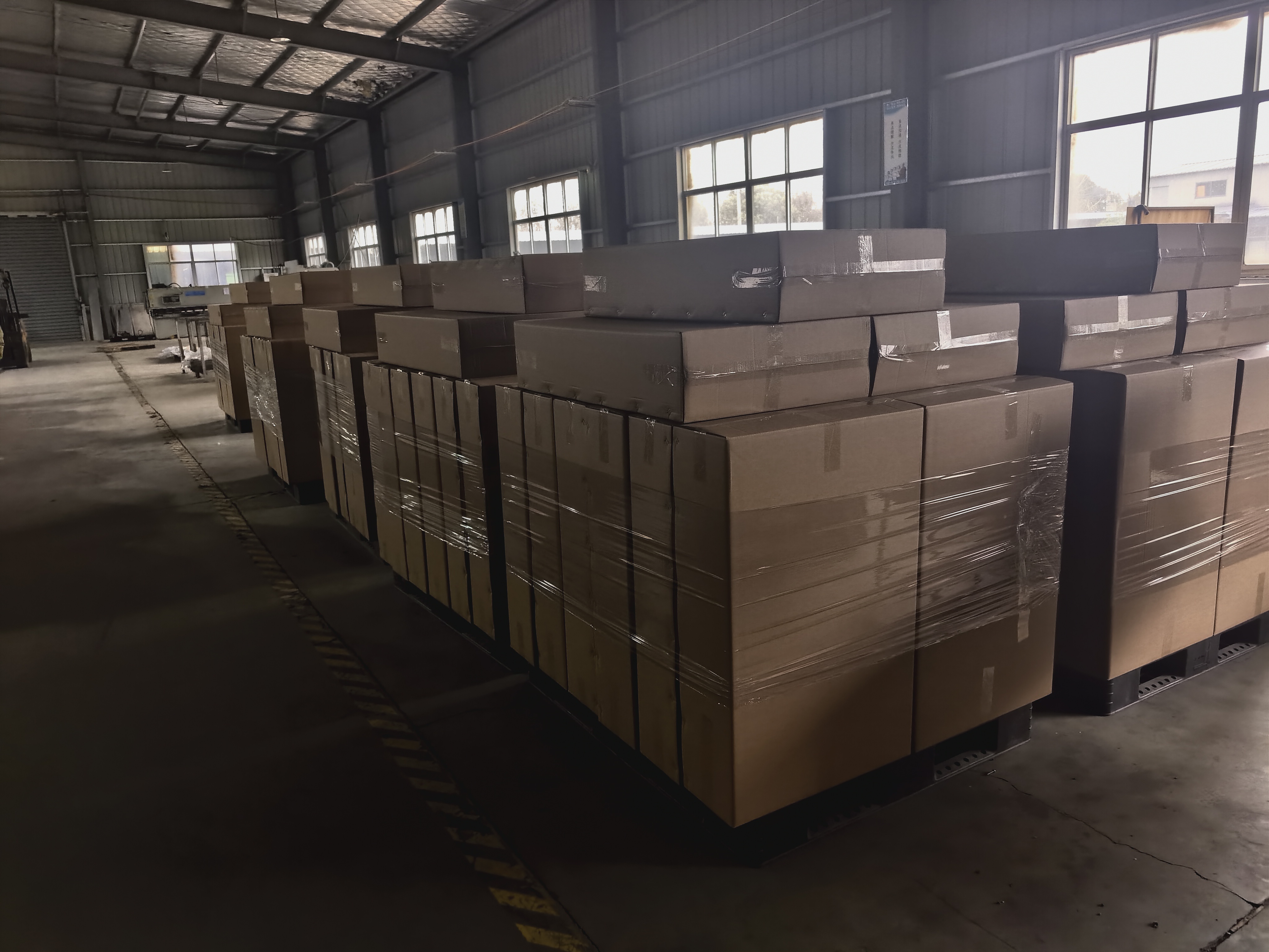 Packed customer orders arranged inside the Donghe facility